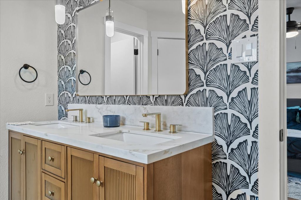 9223 Independence Loop Austin, TX 78748 - Photo 23 of 37 a bathroom with a sink and a mirror
