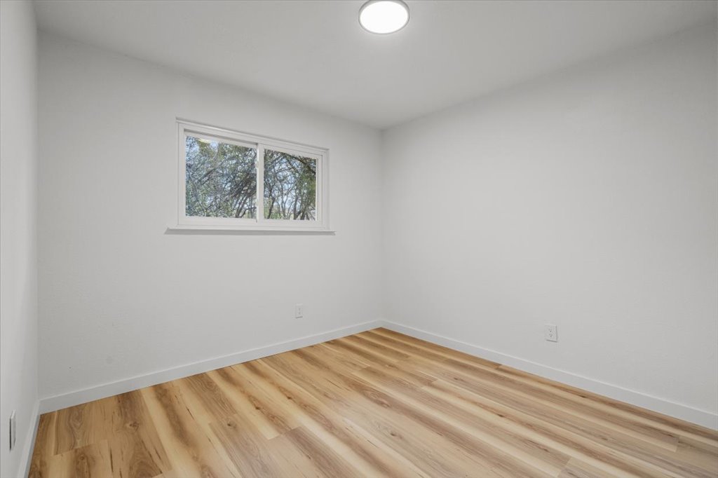 9223 Independence Loop Austin, TX 78748 - Photo 25 of 37 a view of a room with a white wall and a window