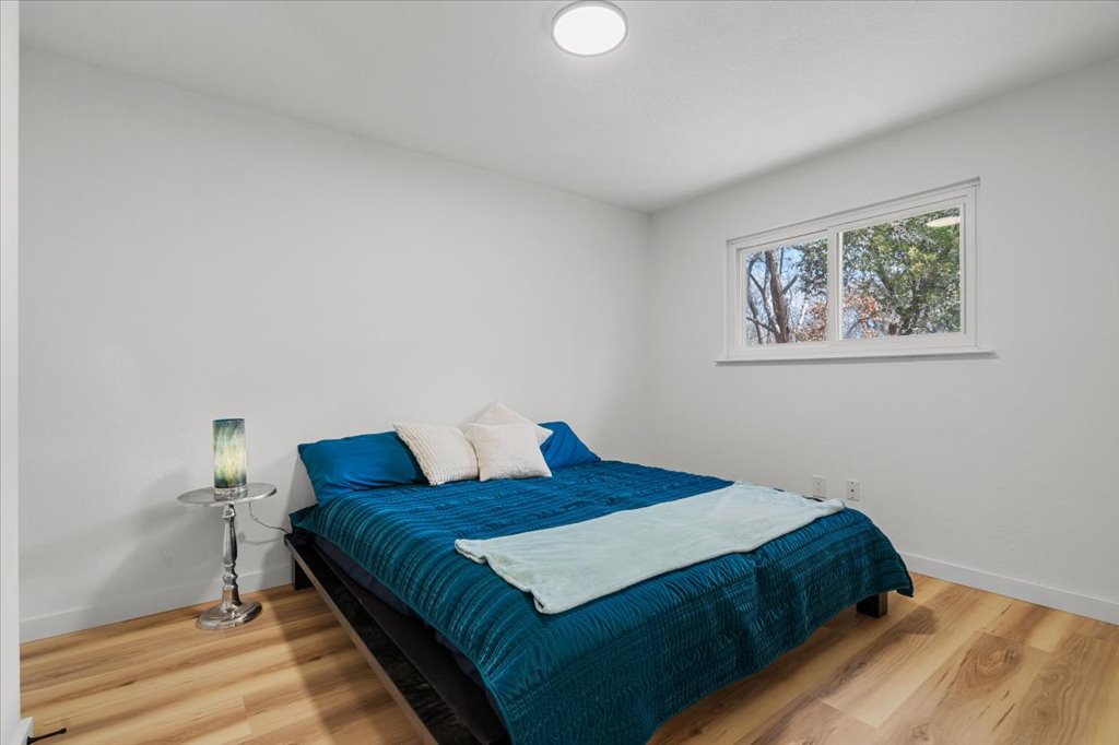 9223 Independence Loop Austin, TX 78748 - Photo 29 of 37 a bedroom with a bed and a painting on the wall