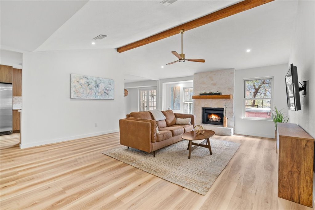 9223 Independence Loop Austin, TX 78748 - Photo 6 of 37 a living room with furniture a fireplace and a table