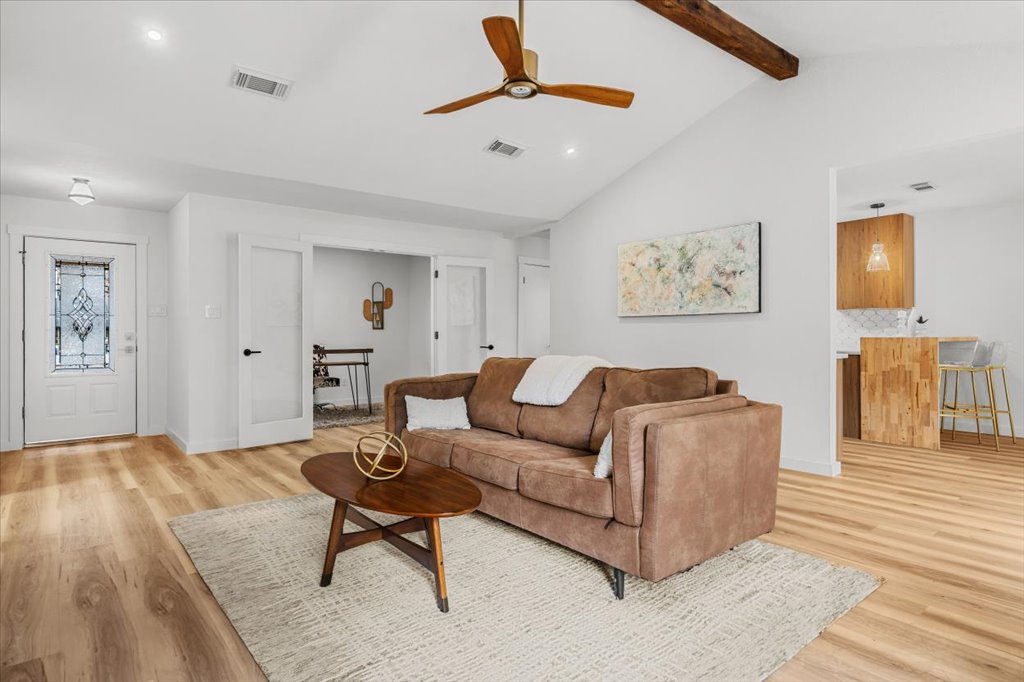 9223 Independence Loop Austin, TX 78748 - Photo 10 of 37 a living room with furniture and a wooden floor