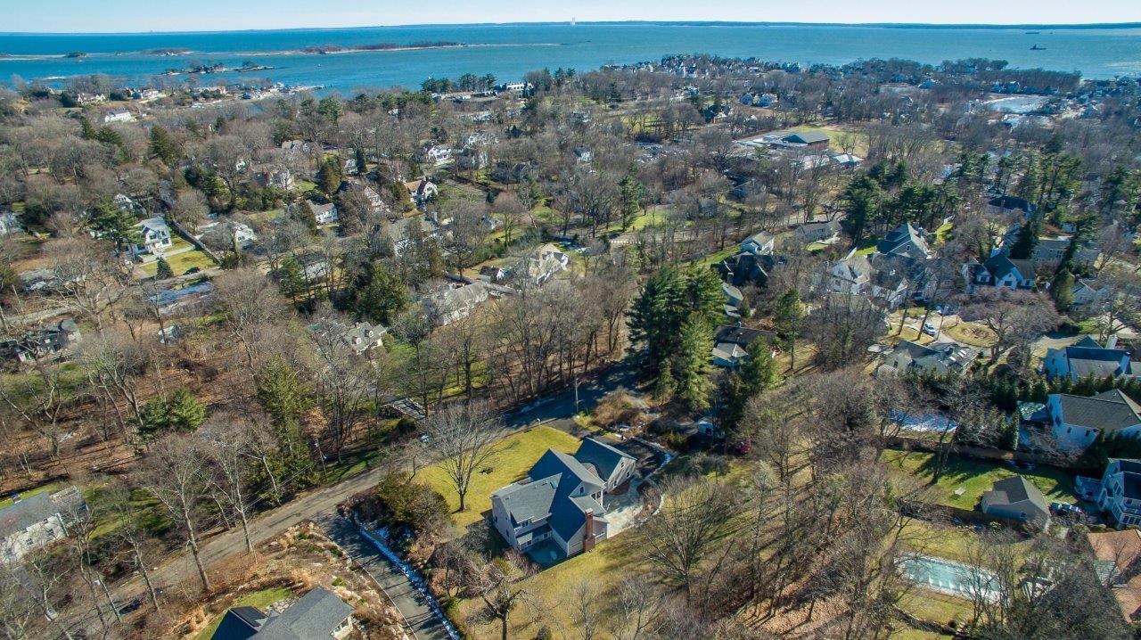 an aerial view of a house with a yard