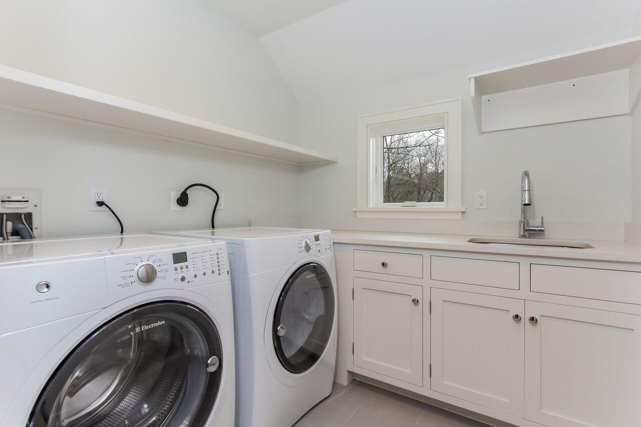 7 Indian Spring Road Rowayton, CT 06853 - Photo 26 of 28 a view of storage and utility room with washer and dryer