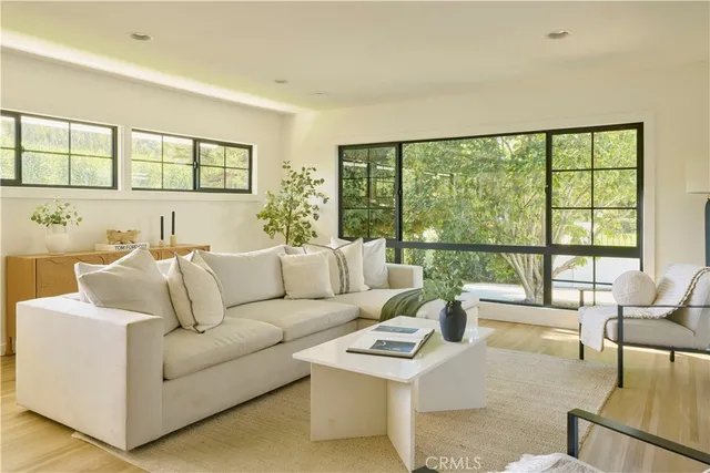a view of a house with backyard porch and sitting area