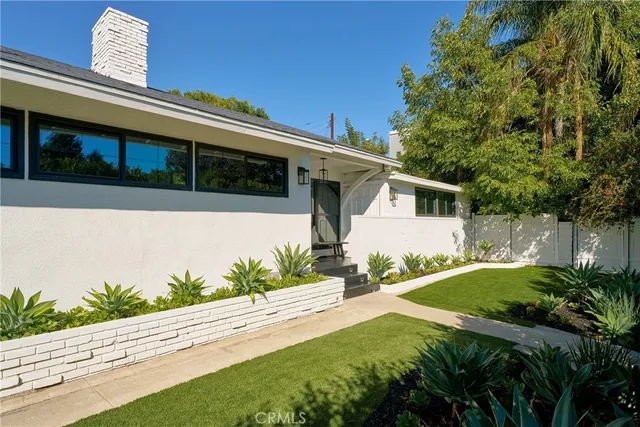 a view of a hallway with washer and dryer