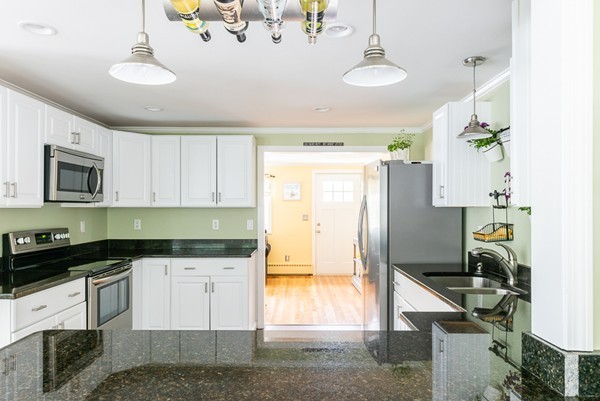 22 Roseen Road Holbrook, MA 02343 - Photo 14 of 30 a kitchen with granite countertop a stove a sink and a refrigerator