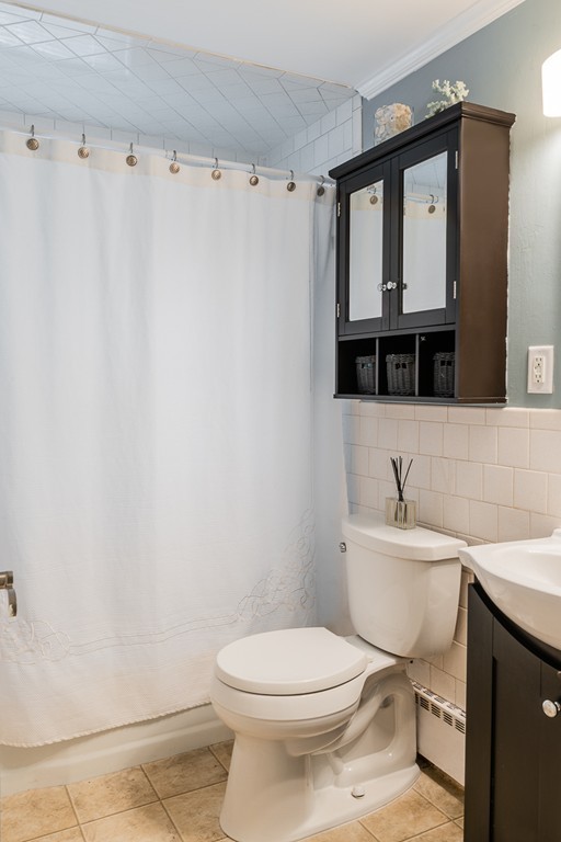 22 Roseen Road Holbrook, MA 02343 - Photo 23 of 30 a bathroom with a toilet a sink and a mirror