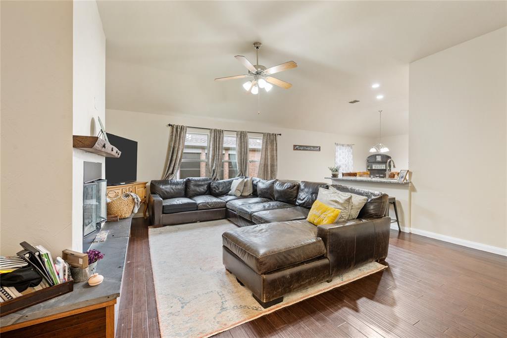 8613 King Ranch Drive Cross Roads, TX 76227 - Photo 3 of 25 a living room with furniture and a chandelier