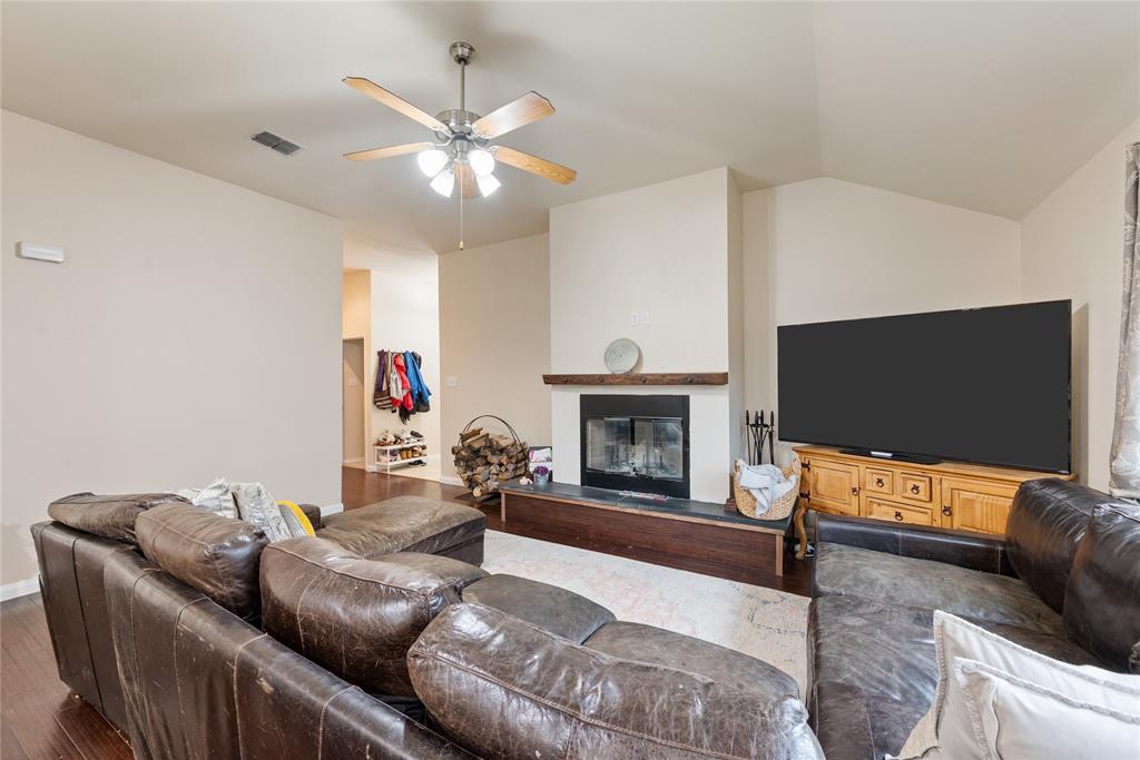 8613 King Ranch Drive Cross Roads, TX 76227 - Photo 5 of 25 a living room with furniture and a flat screen tv