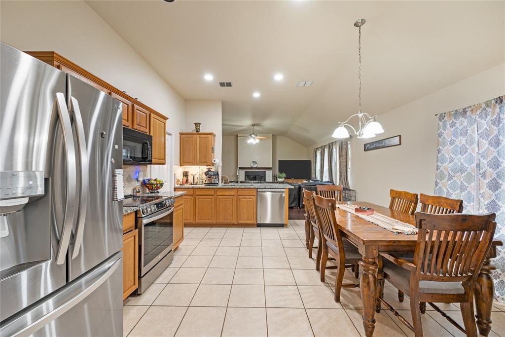 8613 King Ranch Drive Cross Roads, TX 76227 - Photo 9 of 25 a large kitchen with granite countertop lots of counter top space