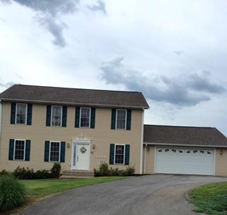 176 MacGregor Drive Blue Ridge, VA 24064 - Photo 3 of 28 a front view of a house with a garden
