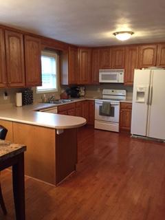 176 MacGregor Drive Blue Ridge, VA 24064 - Photo 7 of 28 a kitchen with stainless steel appliances granite countertop a stove a sink dishwasher a refrigerator and a microwave oven