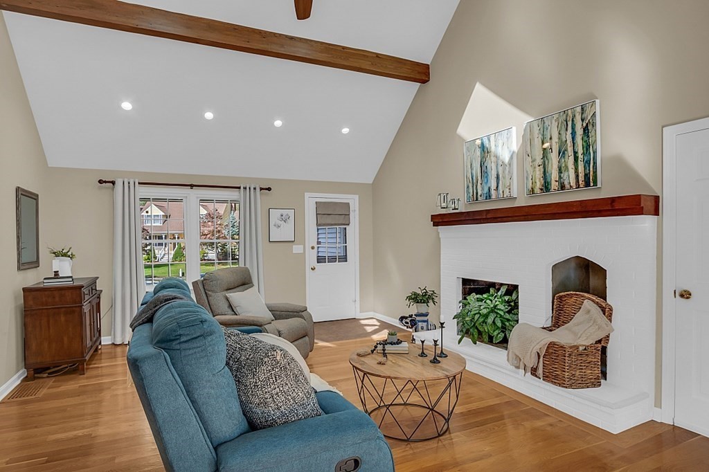 27 Sable Run Lane Methuen, MA 01844 - Photo 13 of 42 a living room with furniture and a fireplace