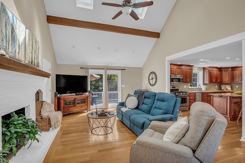 27 Sable Run Lane Methuen, MA 01844 - Photo 14 of 42 a living room with furniture and a flat screen tv