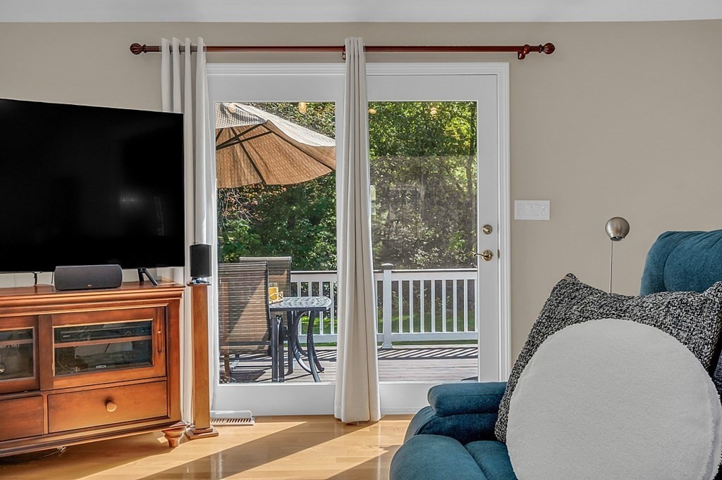 27 Sable Run Lane Methuen, MA 01844 - Photo 15 of 42 a living room with furniture and a flat screen tv