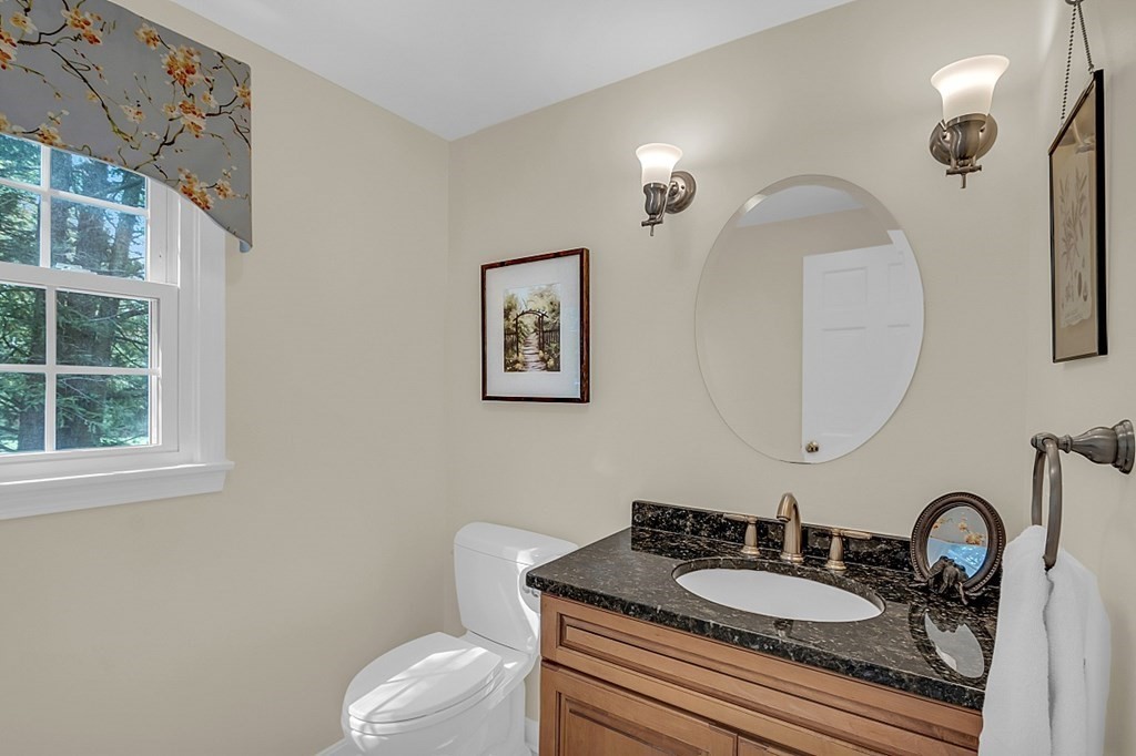 27 Sable Run Lane Methuen, MA 01844 - Photo 17 of 42 a bathroom with a granite countertop toilet a sink and a mirror