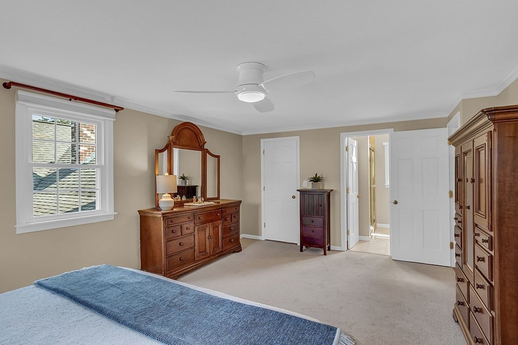 27 Sable Run Lane Methuen, MA 01844 - Photo 21 of 42 a bed room with a bed and a dresser