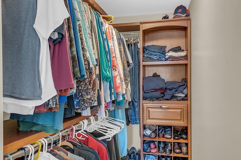 27 Sable Run Lane Methuen, MA 01844 - Photo 22 of 42 a view of walk in closet with clothes and shoes