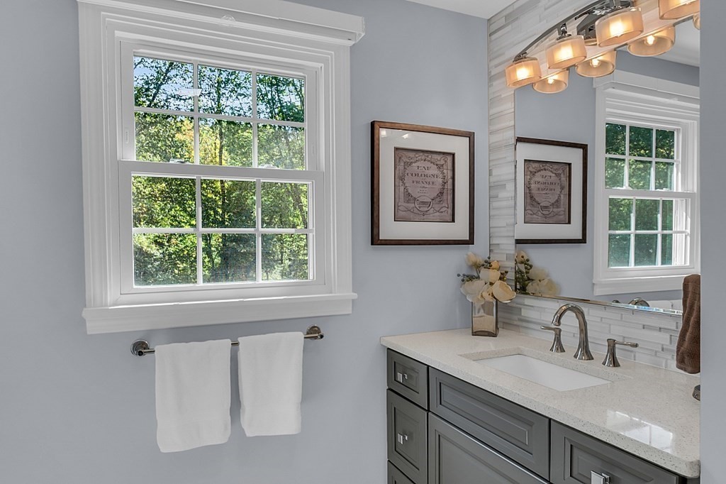 27 Sable Run Lane Methuen, MA 01844 - Photo 27 of 42 a bathroom with a granite countertop sink mirror and window