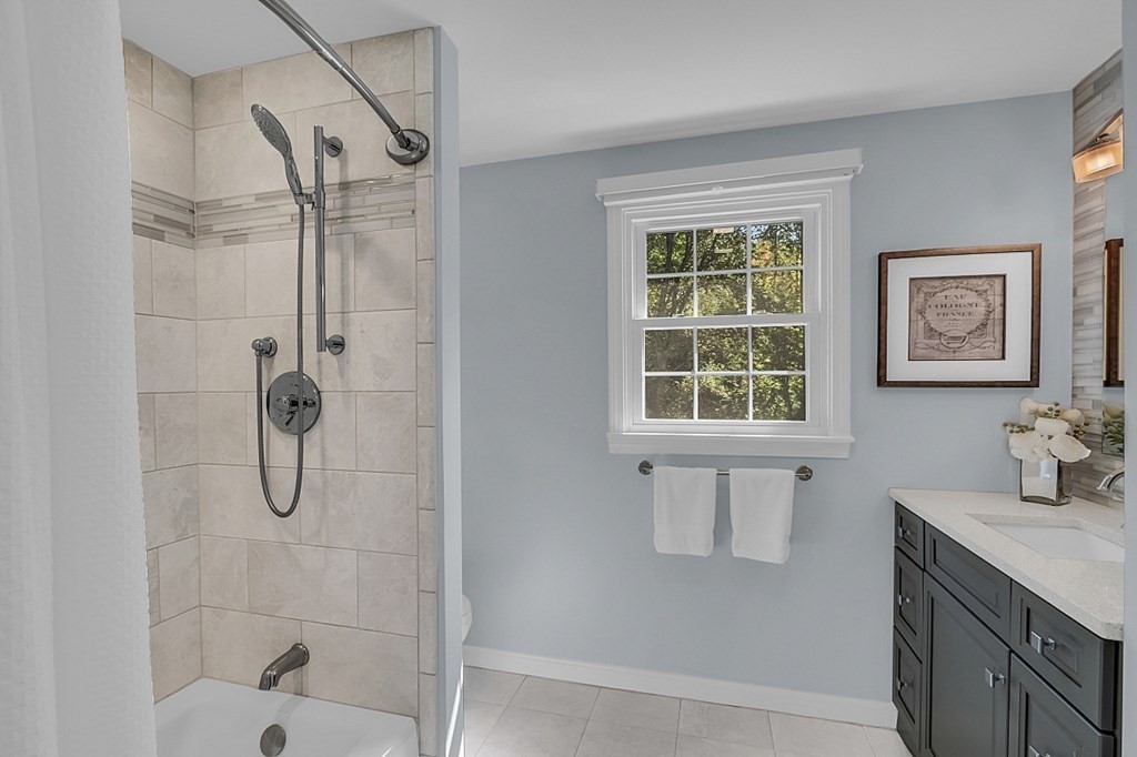 27 Sable Run Lane Methuen, MA 01844 - Photo 28 of 42 a bathroom with a granite countertop sink a window and shower