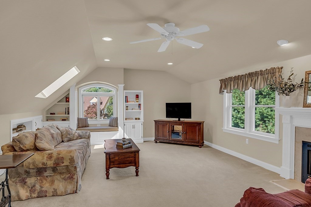 27 Sable Run Lane Methuen, MA 01844 - Photo 35 of 42 a living room with furniture and a flat screen tv