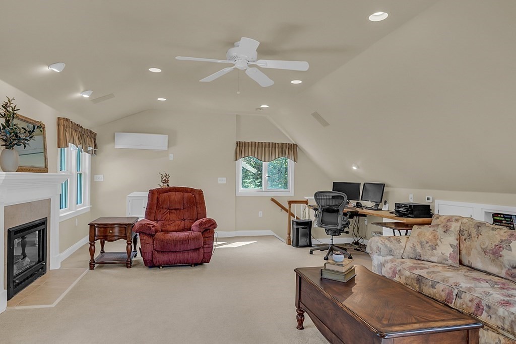 27 Sable Run Lane Methuen, MA 01844 - Photo 36 of 42 a living room with furniture and a flat screen tv