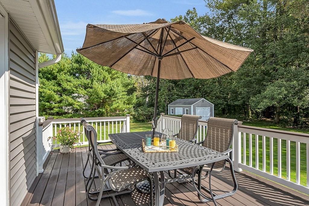 27 Sable Run Lane Methuen, MA 01844 - Photo 39 of 42 a view of balcony with furniture and umbrella