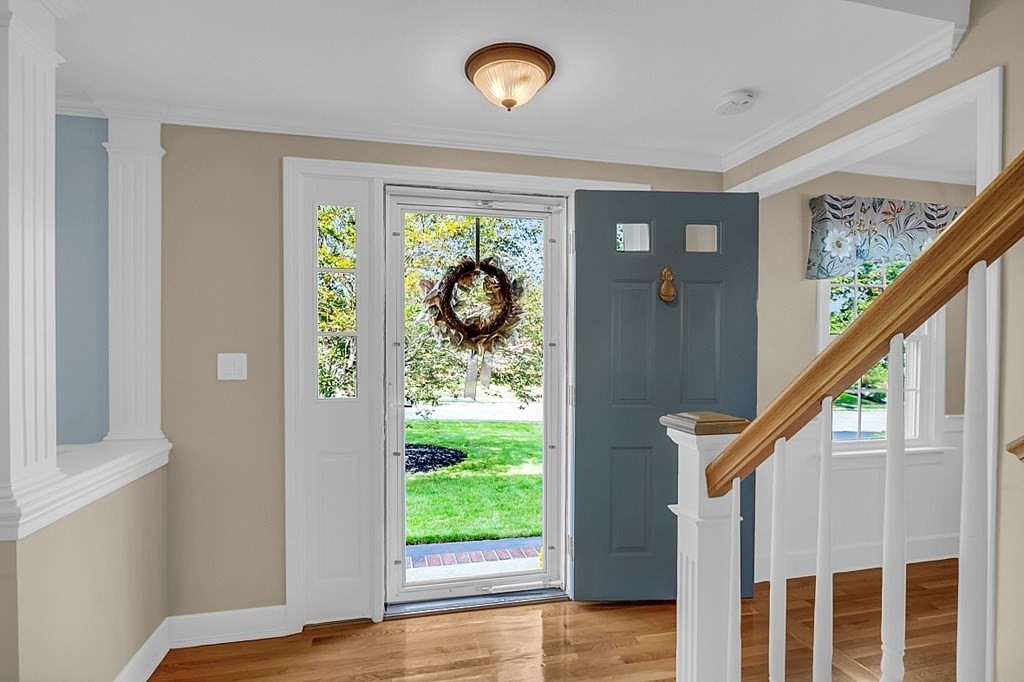 27 Sable Run Lane Methuen, MA 01844 - Photo 5 of 42 a view of front door and porch with wooden floor