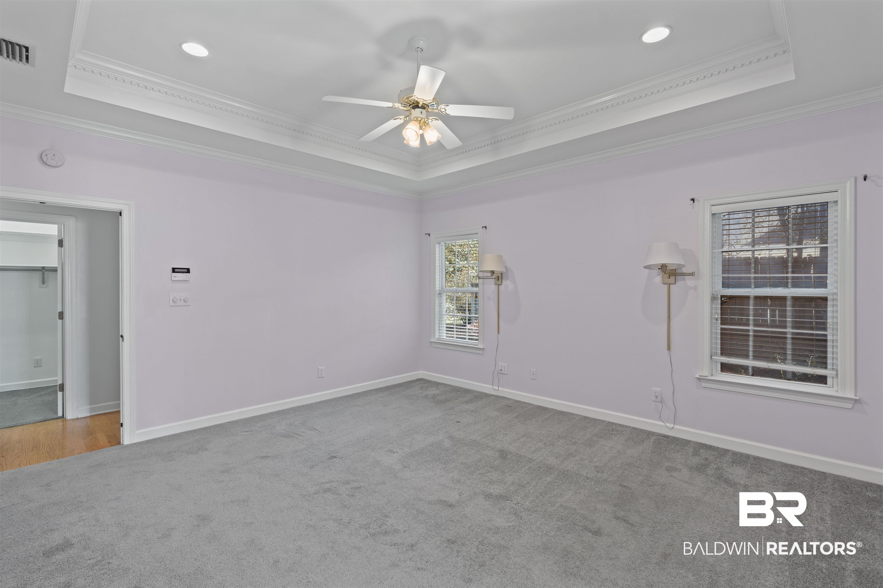 4 Judd Trail Daphne, AL 36527 - Photo 25 of 45 Spare room with a tray ceiling, baseboards, and a ceiling fan