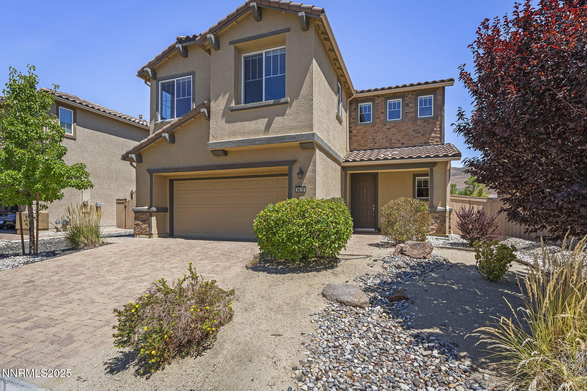 9610 Eventer Lane Reno, NV 89521 - Photo 1 of 38 a front view of a house with garden