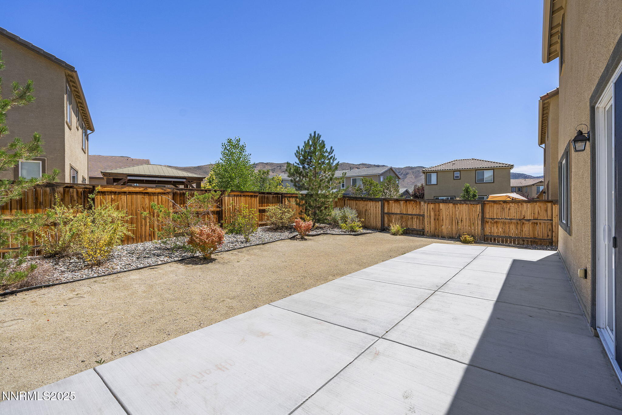 9610 Eventer Lane Reno, NV 89521 - Photo 22 of 38 a view of a terrace with a bench