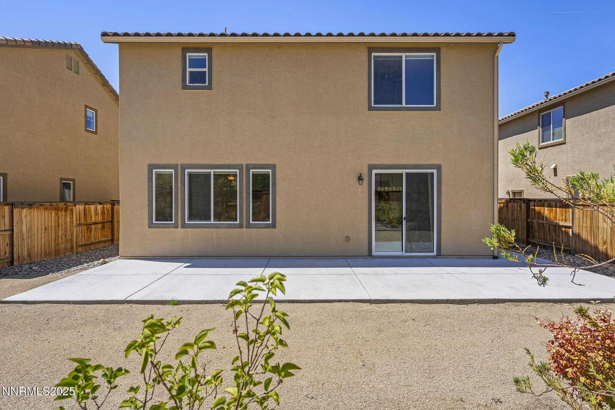9610 Eventer Lane Reno, NV 89521 - Photo 24 of 38 a front view of a house with a yard