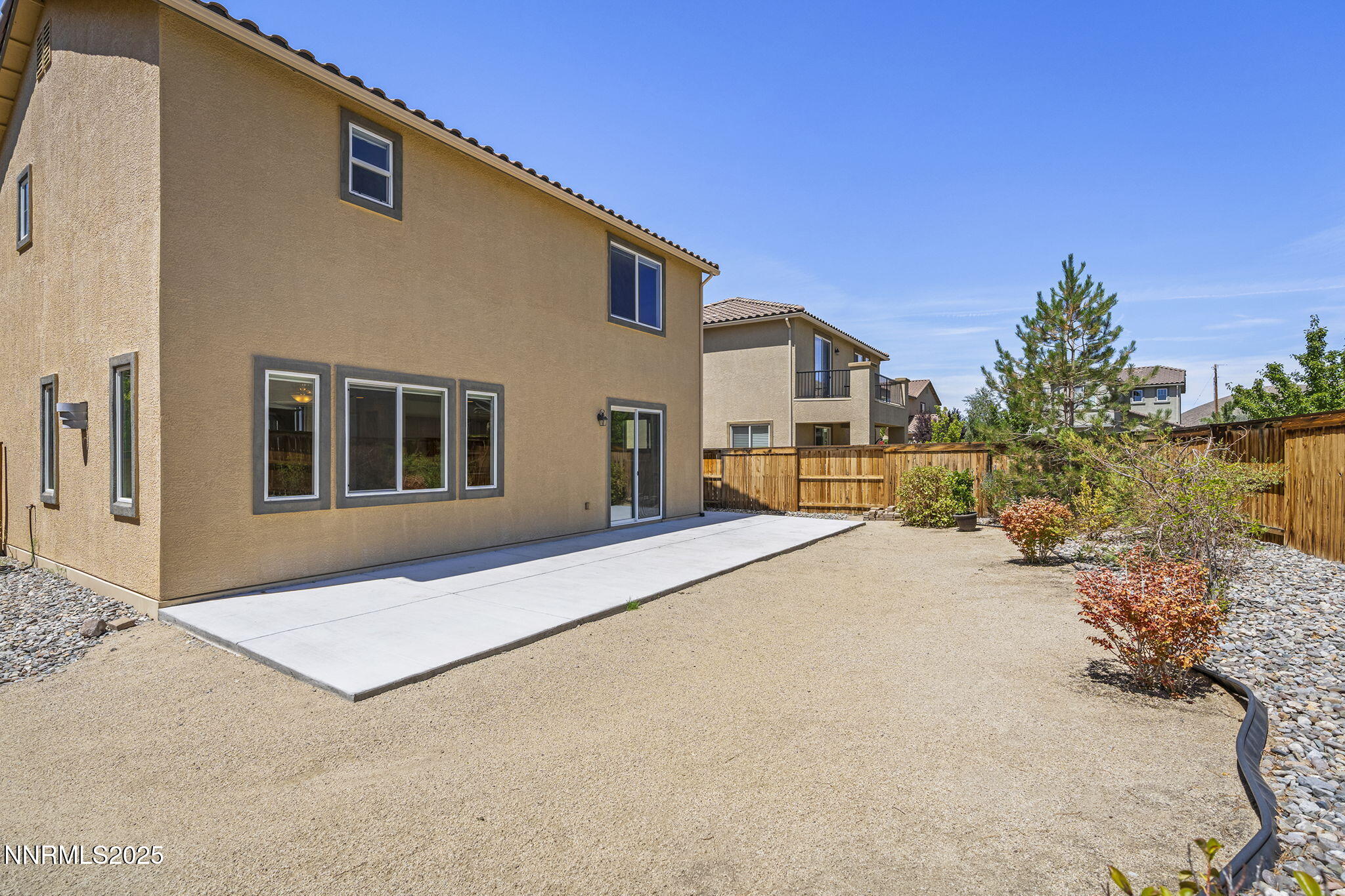 9610 Eventer Lane Reno, NV 89521 - Photo 25 of 38 a front view of a house with a yard