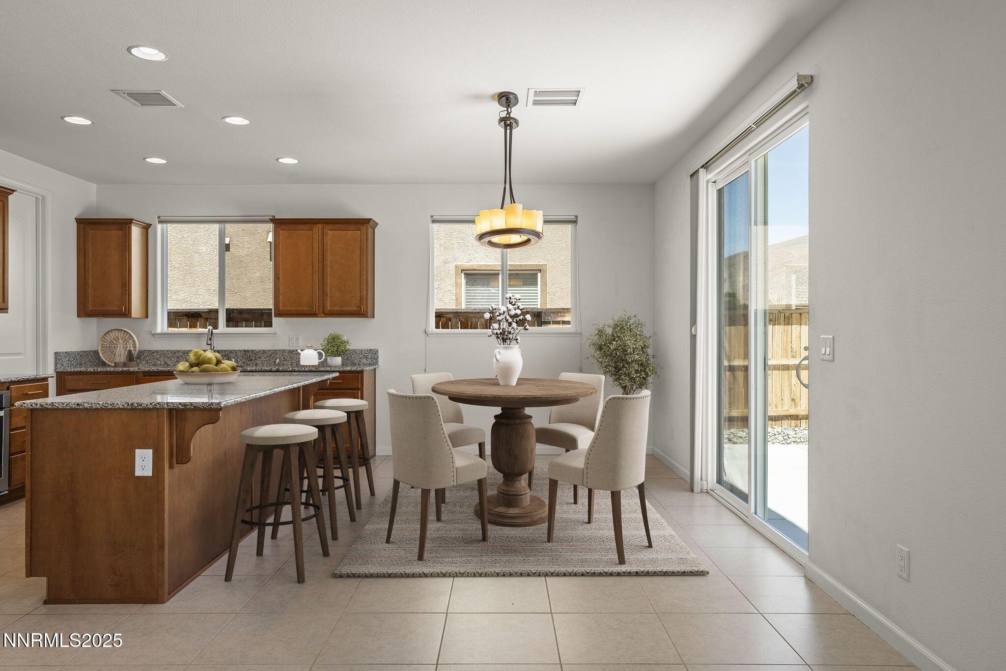 9610 Eventer Lane Reno, NV 89521 - Photo 5 of 38 a view of a dining room with furniture window and outside view