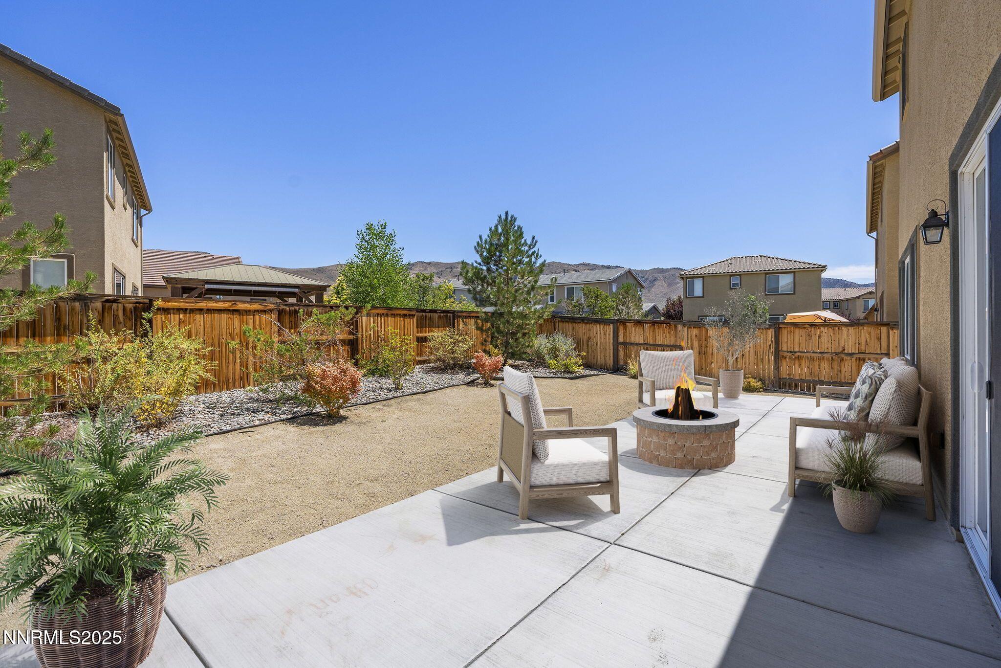 9610 Eventer Lane Reno, NV 89521 - Photo 7 of 38 a view of a patio with couches and potted plants