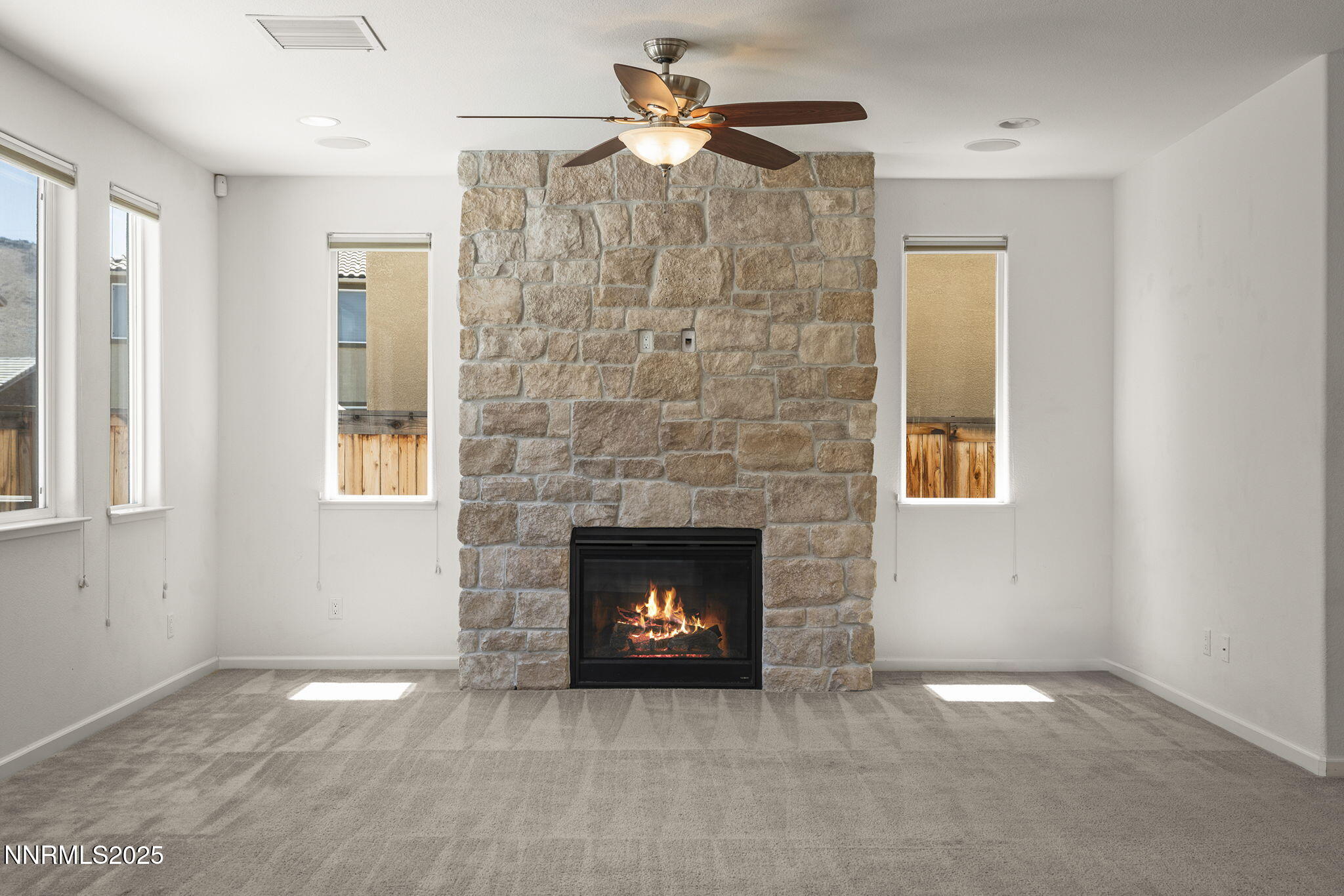 9610 Eventer Lane Reno, NV 89521 - Photo 9 of 38 a room with a fireplace