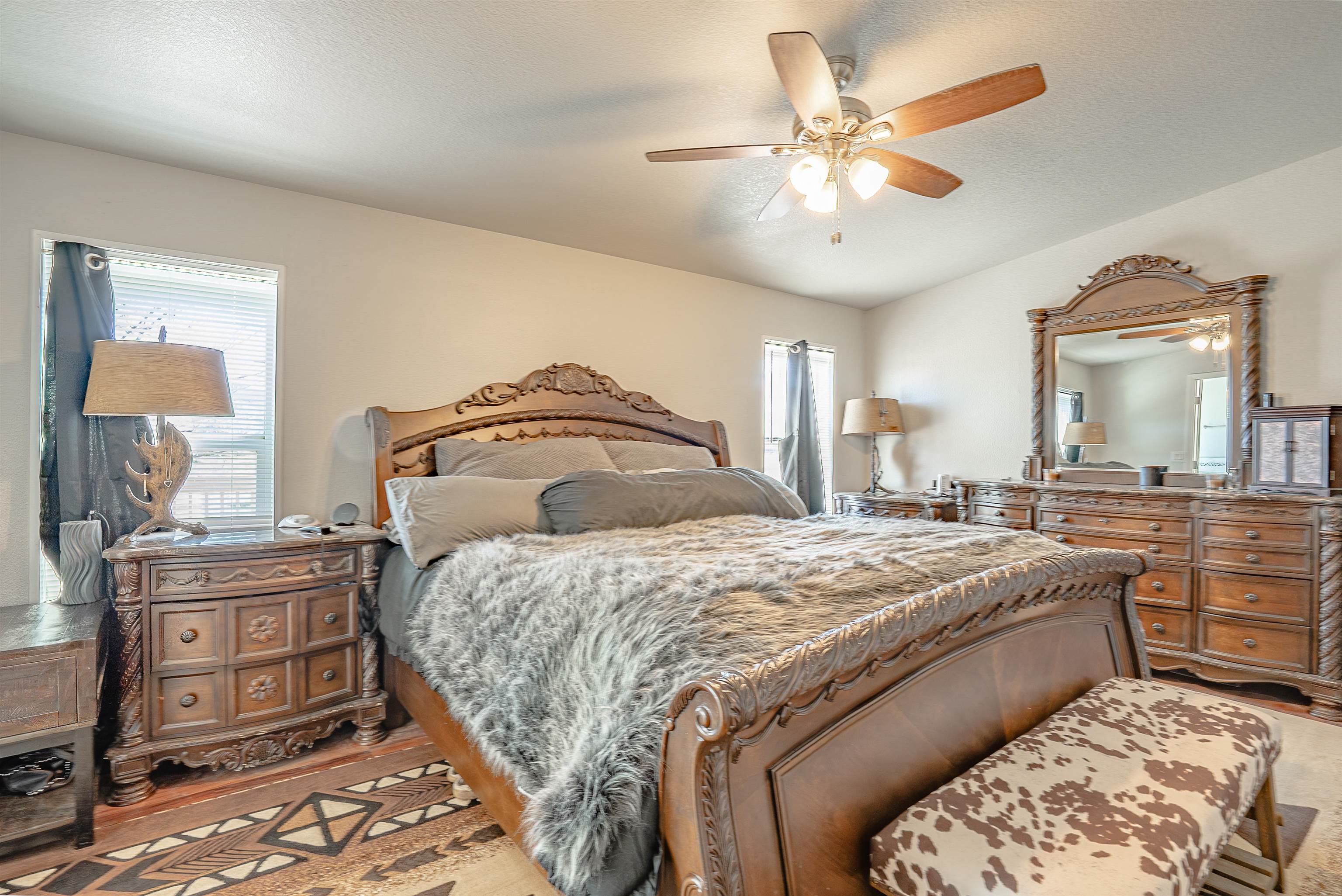 714-100 Sears Road Janesville, CA 96114 - Photo 25 of 35 a spacious bedroom with a bed and a chandelier