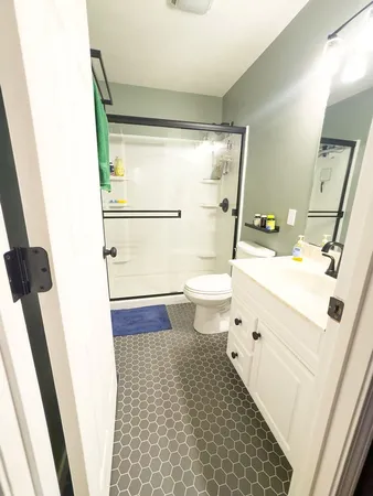 a view of a hallway view with wooden floor and staircase