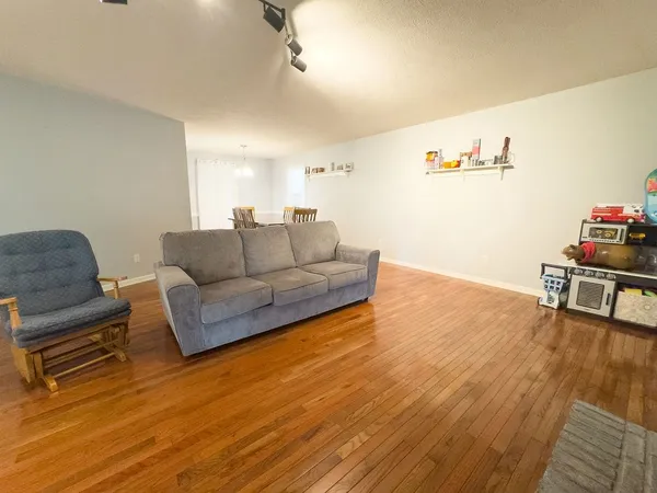 a view of a house with backyard and sitting area