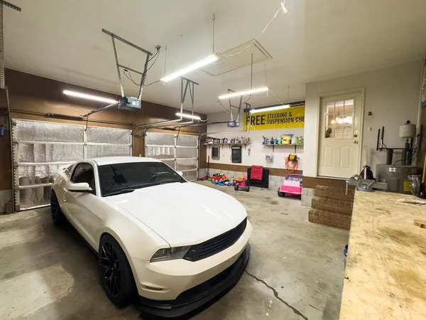 a view of parking garage with cars