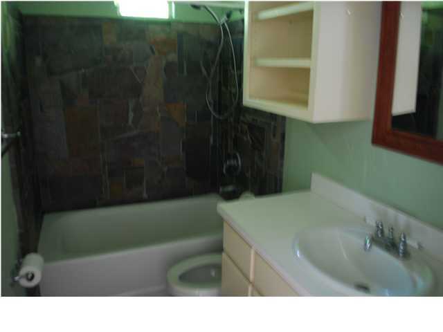 31 Lee Place Santa Rosa Beach, FL 32459 - Photo 7 of 8 a bathroom with a sink a toilet and a bathtub