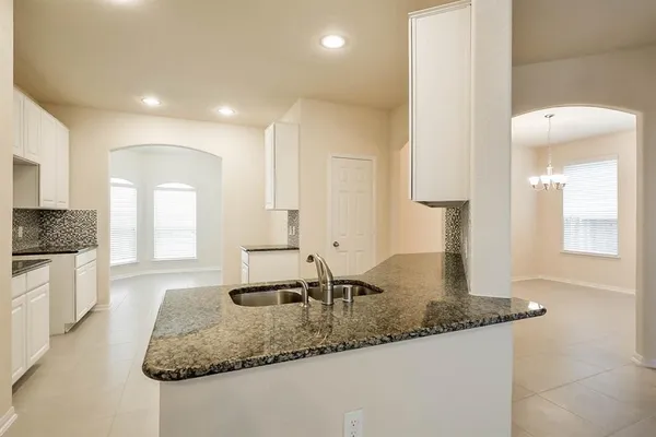 a kitchen with sink and window