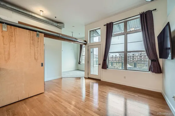a view of entryway with wooden floor