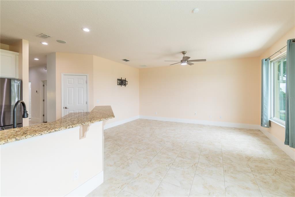 3862 Beacon Ridge Way Clermont, FL 34711 - Photo 33 of 56 a view of a living room and a ceiling fan