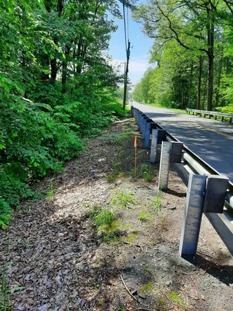 a view of backyard with green space and deck