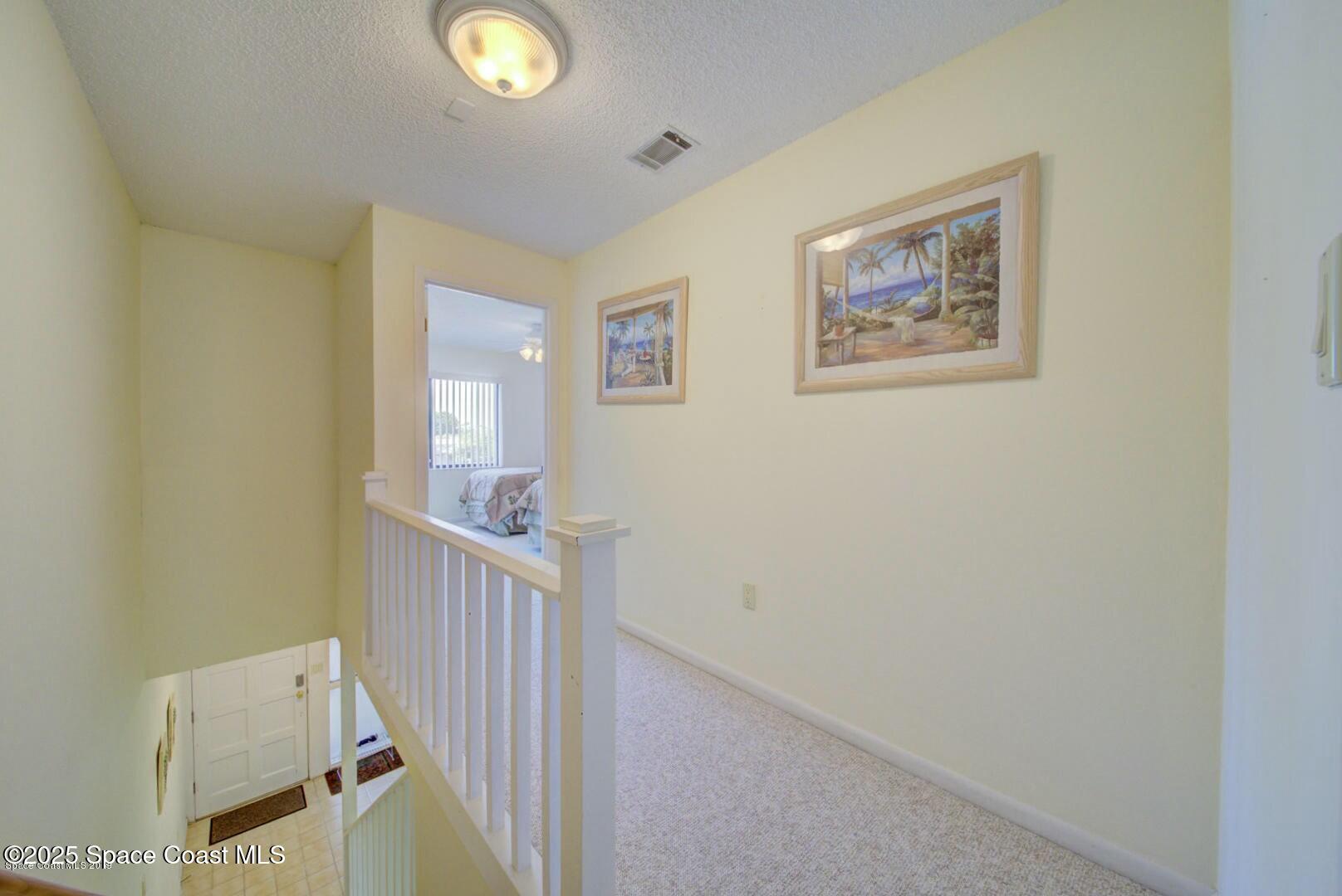 227 Augusta Way Melbourne, FL 32940 - Photo 19 of 35 a view of an entryway with wooden floor