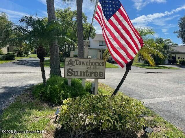 227 Augusta Way Melbourne, FL 32940 - Photo 35 of 35 a view of outdoor space with signage and flags