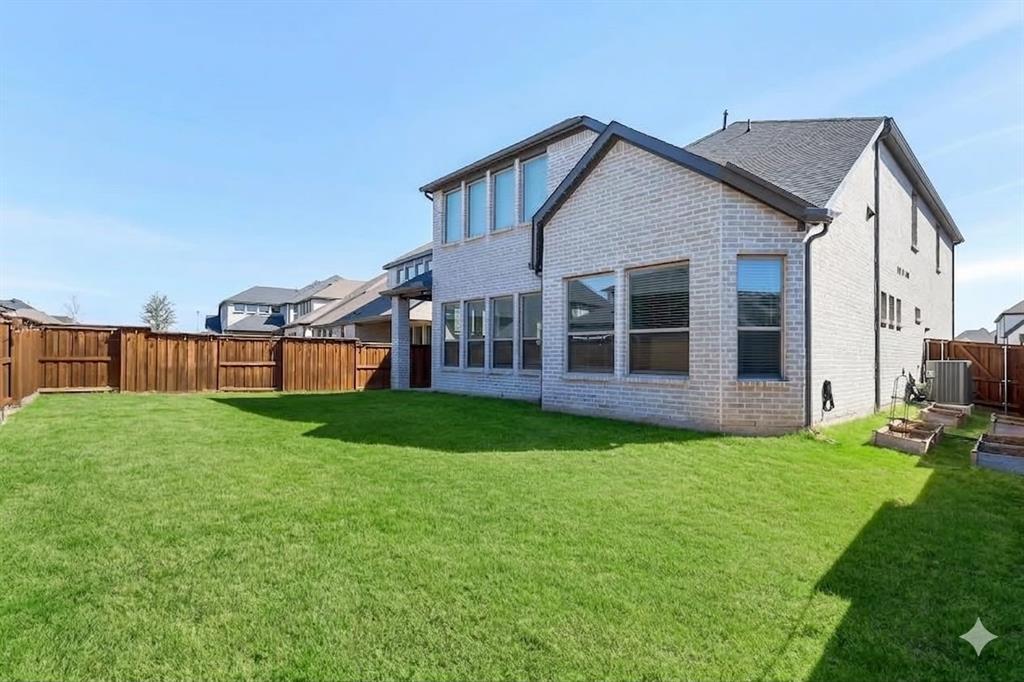 1241 Lupine Road Prosper, TX 75078 - Photo 38 of 38 Expansive green lawn enclosed by a durable wood fence