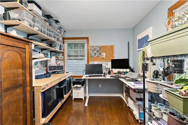 a kitchen with stainless steel appliances a stove top oven and a refrigerator