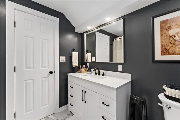 a bathroom with 2 sink and a mirror